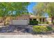 Charming single-story home featuring a well-maintained front yard and brick-paved driveway at 2026 Poppywood Ave, Henderson, NV 89012