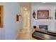 Bright hallway leading to the main living areas, featuring decorative wall art and neutral tiling at 2026 Poppywood Ave, Henderson, NV 89012