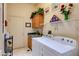 Well-organized laundry room with cabinets, shelving, and updated appliances at 2026 Poppywood Ave, Henderson, NV 89012