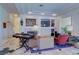 Cozy living room with a fireplace, recessed lighting, and a large window at 2026 Poppywood Ave, Henderson, NV 89012