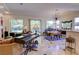 Open-concept living and dining area featuring stylish tile flooring and bright natural light at 2026 Poppywood Ave, Henderson, NV 89012