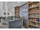 Full bar features a stone countertop, ample seating, and a wine refrigerator at 2058 Troon Dr, Henderson, NV 89074