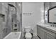 Bathroom featuring modern gray tiled walls, a soaking tub, and a stylish vanity at 2058 Troon Dr, Henderson, NV 89074