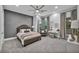 Spacious bedroom with a ceiling fan, neutral color scheme, and balcony access at 2058 Troon Dr, Henderson, NV 89074