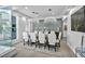 Modern dining room with a large table, chandelier lighting, and stylish decor at 2058 Troon Dr, Henderson, NV 89074