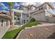 Rear exterior view of the home highlighting its architecture, landscaping, and outdoor space at 2058 Troon Dr, Henderson, NV 89074