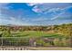 Beautiful views of the manicured golf course, mountain views in the distance, and scenic neighborhood at 2058 Troon Dr, Henderson, NV 89074