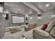 Home theater room featuring a large screen, speakers, tiered seating, and comfortable seating at 2058 Troon Dr, Henderson, NV 89074