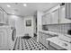 Modern laundry room with washer, dryer, countertop space, and stylish tile flooring at 2058 Troon Dr, Henderson, NV 89074