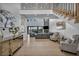 Spacious living room with fireplace, hardwood floors, and view of the backyard at 2058 Troon Dr, Henderson, NV 89074