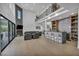 Open floor plan with high ceilings, fireplace, bar and access to the backyard at 2058 Troon Dr, Henderson, NV 89074