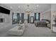 Spacious primary bedroom boasts a seating area, marble fireplace, and large windows, offering luxury and comfort at 2058 Troon Dr, Henderson, NV 89074