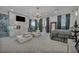 Elegant primary bedroom with fireplace, seating area, and ample natural light showcases luxurious design and comfort at 2058 Troon Dr, Henderson, NV 89074