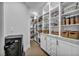 Walk-in pantry with ample shelving and storage for food and kitchen essentials at 2058 Troon Dr, Henderson, NV 89074