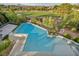 Beautiful pool featuring a raised jacuzzi and lush greenery at 2058 Troon Dr, Henderson, NV 89074