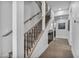 Bright staircase showcasing wood railings and black balusters with hardwood floors and modern design at 2058 Troon Dr, Henderson, NV 89074