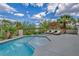 Luxurious swimming pool featuring a spa, surrounded by landscaping and lounge chairs at 2058 Troon Dr, Henderson, NV 89074