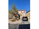 Charming two-story home featuring red shutters, a well-kept lawn, and a private driveway on a sunny day at 2190 Clancy St, Las Vegas, NV 89156