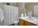 Bathroom featuring a white shower curtain, single sink, and unique turtle decor accents at 2331 Galilean Moon St, Henderson, NV 89044
