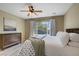 Bedroom featuring wood-look flooring, a large window, dresser, and a queen-sized bed at 2331 Galilean Moon St, Henderson, NV 89044