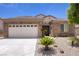 Charming single-story home featuring a well-manicured desert landscape and a spacious two-car garage at 2331 Galilean Moon St, Henderson, NV 89044