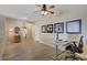 Versatile living space with wood-look tile, suitable for use as a home office or den at 2331 Galilean Moon St, Henderson, NV 89044