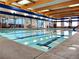 Bright indoor pool area with lane markers and large windows for natural light at 2331 Galilean Moon St, Henderson, NV 89044