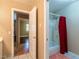 Bathroom doorway leads to a shower/tub and bedroom with wood-style flooring at 268 Copper Glow Ct, Henderson, NV 89074