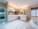 Large primary bathroom with dual sinks and vanity, providing a spacious and functional space at 268 Copper Glow Ct, Henderson, NV 89074