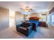 Large bedroom showcasing a seating area, neutral walls, and natural light, creating a tranquil and inviting space at 268 Copper Glow Ct, Henderson, NV 89074
