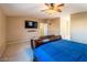 Bright primary bedroom with TV features neutral walls, providing a relaxing retreat within the home at 268 Copper Glow Ct, Henderson, NV 89074