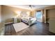 Charming bedroom featuring light-colored furniture, window, and wood-style flooring at 268 Copper Glow Ct, Henderson, NV 89074