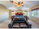 Spacious bedroom features a cozy seating area and natural light, providing a relaxing and comfortable environment at 268 Copper Glow Ct, Henderson, NV 89074