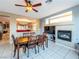 Dining room with ceiling fan, fireplace, and access to the living area at 268 Copper Glow Ct, Henderson, NV 89074