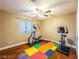 Functional exercise room with ceiling fan, home gym equipment, and colorful flooring at 268 Copper Glow Ct, Henderson, NV 89074