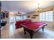 Spacious game room with a pool table, tile flooring, and ample natural light at 268 Copper Glow Ct, Henderson, NV 89074