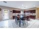Functional kitchen area with ample cabinet space, a center island, and access to the backyard pool at 268 Copper Glow Ct, Henderson, NV 89074