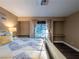 Bright main bedroom featuring shelving, built-in desks, window and bed with storage at 268 Copper Glow Ct, Henderson, NV 89074
