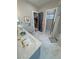 Well-lit bathroom features a double vanity with walk-in shower at 2891 S Rainbow Ave, Pahrump, NV 89048