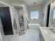 Bright bathroom with a modern tub, walk-in shower, and sleek vanity at 2891 S Rainbow Ave, Pahrump, NV 89048