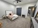 Bright bedroom featuring cozy carpet and a decorative headboard, perfect for relaxation at 2891 S Rainbow Ave, Pahrump, NV 89048