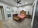 Comfortable bedroom with plush carpeting and a decorative headboard at 2891 S Rainbow Ave, Pahrump, NV 89048