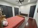 Well-lit bedroom featuring plush carpet and dark closet doors, creating a cozy atmosphere at 2891 S Rainbow Ave, Pahrump, NV 89048