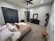 Comfortable bedroom with plush carpeting and ample closet space, offering convenience and style at 2891 S Rainbow Ave, Pahrump, NV 89048