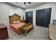 A cozy bedroom features a decorative headboard and is complemented by sleek, dark closet doors at 2891 S Rainbow Ave, Pahrump, NV 89048