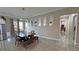 Bright dining room with modern chandelier, sleek table, and decorative wall mirrors at 2891 S Rainbow Ave, Pahrump, NV 89048