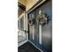 Elegant black double front doors adorned with decorative wreaths and ornate ironwork at 2891 S Rainbow Ave, Pahrump, NV 89048