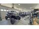 Well-organized garage featuring multiple vehicles and organized storage at 2891 S Rainbow Ave, Pahrump, NV 89048