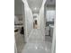Hallway featuring access to the laundry room and main bedroom at 2891 S Rainbow Ave, Pahrump, NV 89048