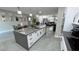 Bright kitchen showcasing a large island with a sink, flowing into the living area with comfortable seating at 2891 S Rainbow Ave, Pahrump, NV 89048